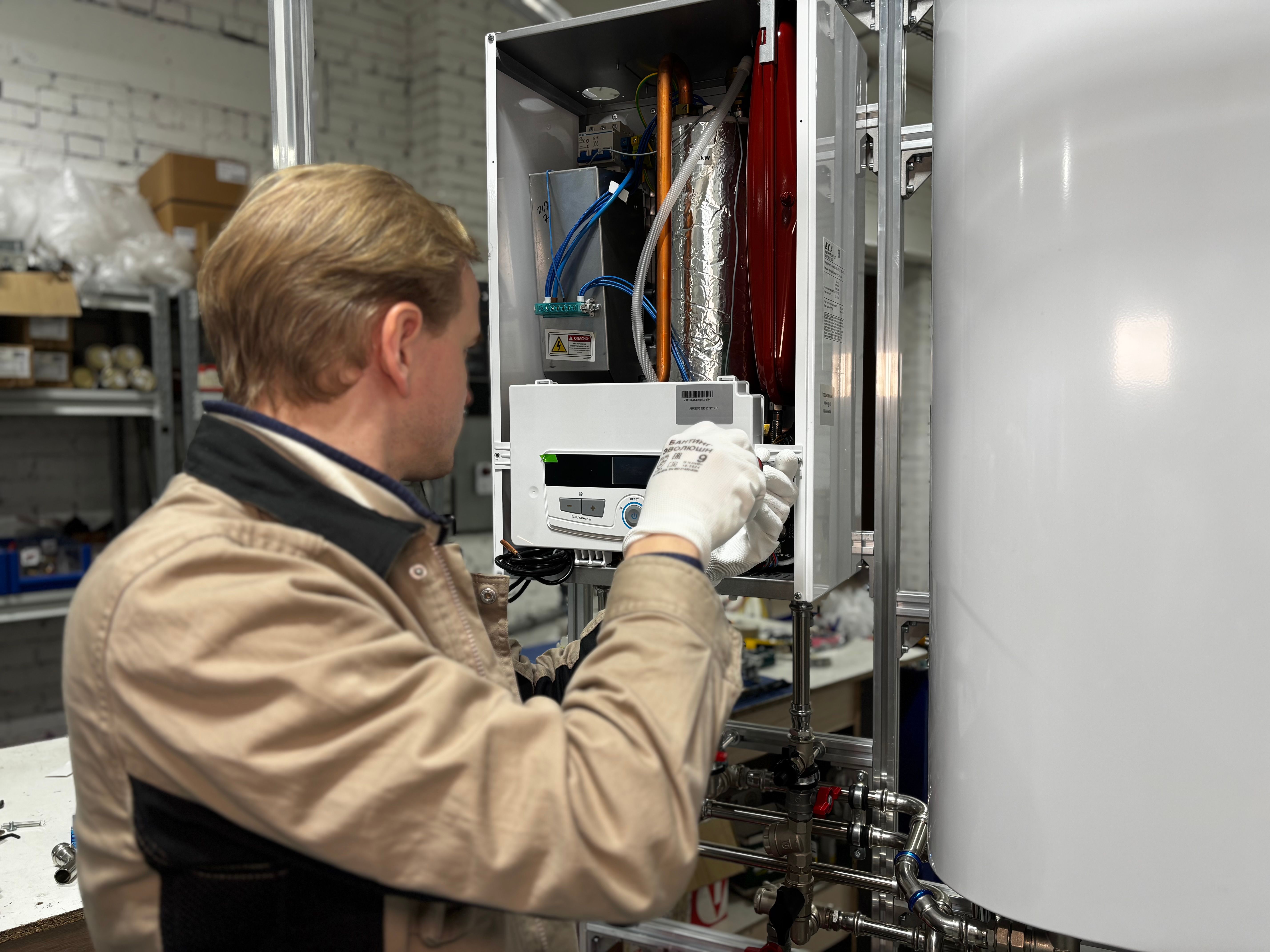 Technician discussing a water heater estimate with a homeowner